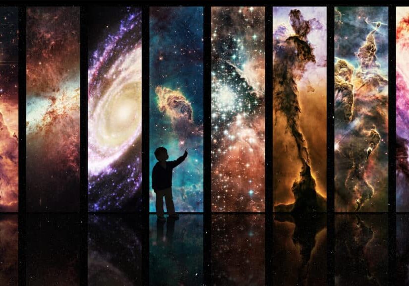 Silhouette of a child looking at a display of varying galactic phenomena- ALL design on this image is created from scratch by Yuri Arcurs team of professionals for this particular photo shoot.